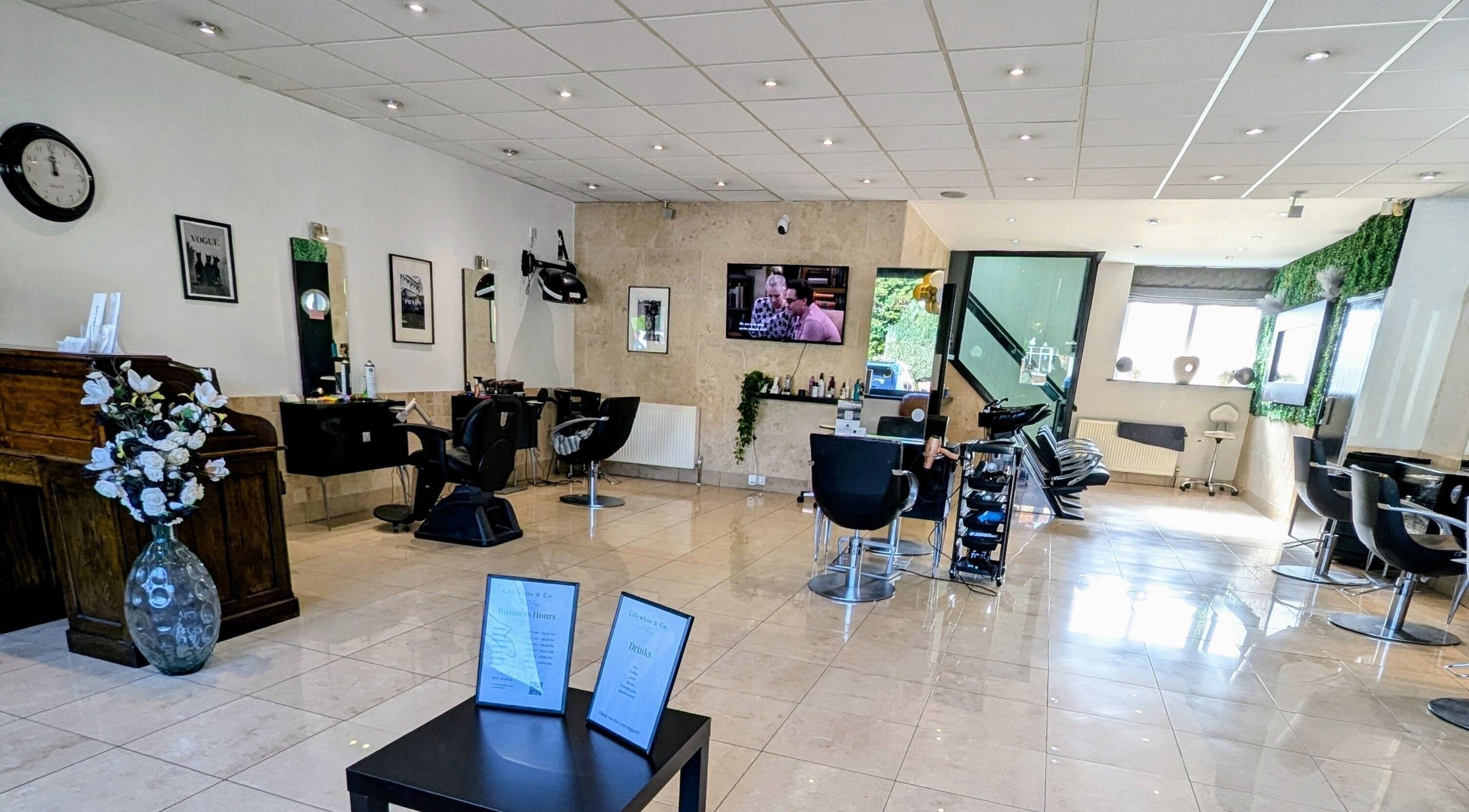 Beautiful salon interior of Bex at Lillywhite & Co. in Wakefield, England, GB showcasing modern decor and seating.