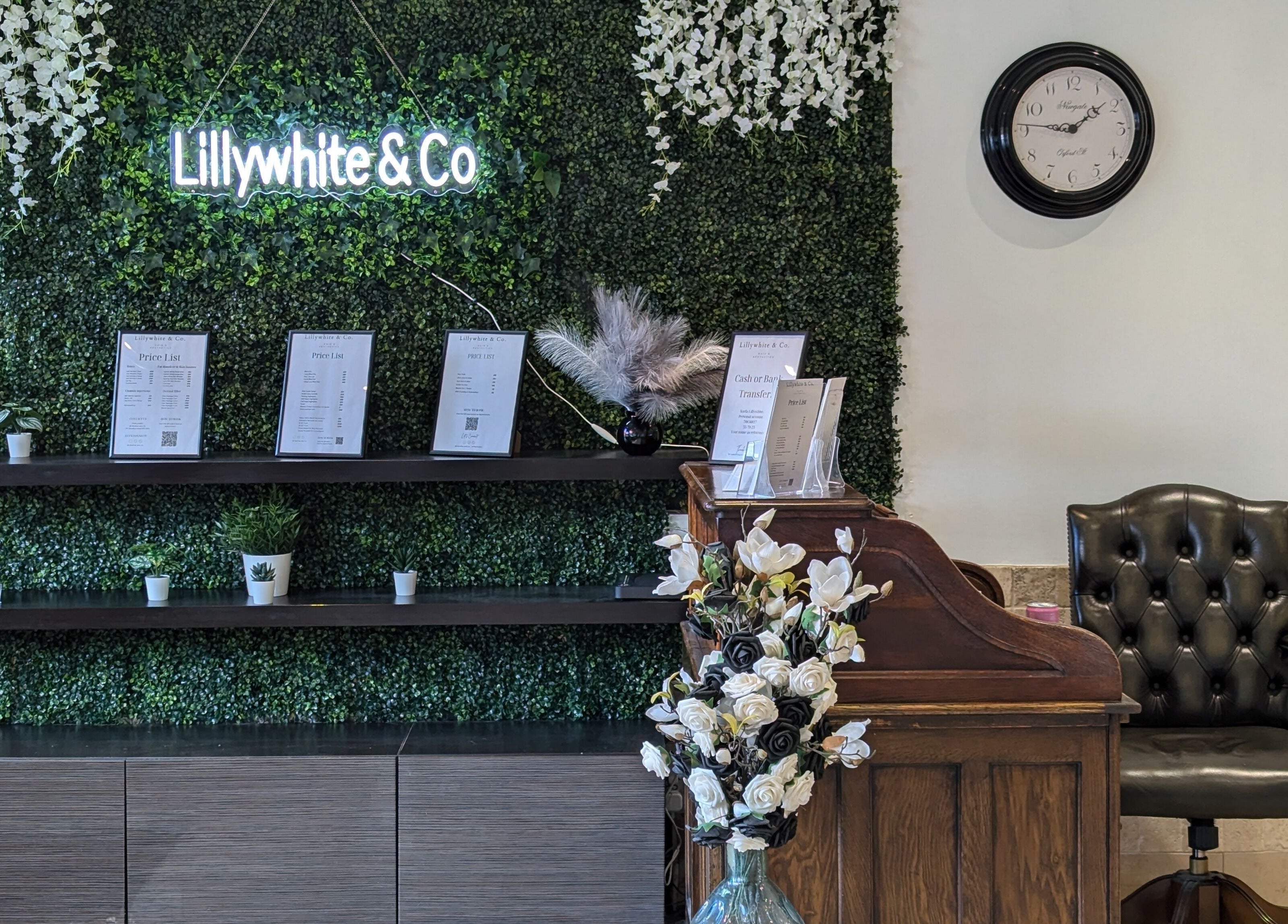 Reception area of Bex at Lillywhite & Co. in Wakefield, England, GB with foliage wall and elegant decor.