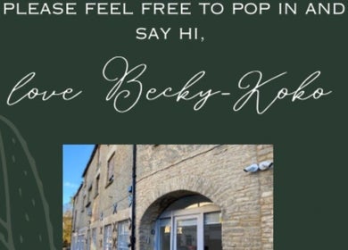 Entrance to Koko - Emma beauty venue in Cirencester, England with stone walls and green signage.