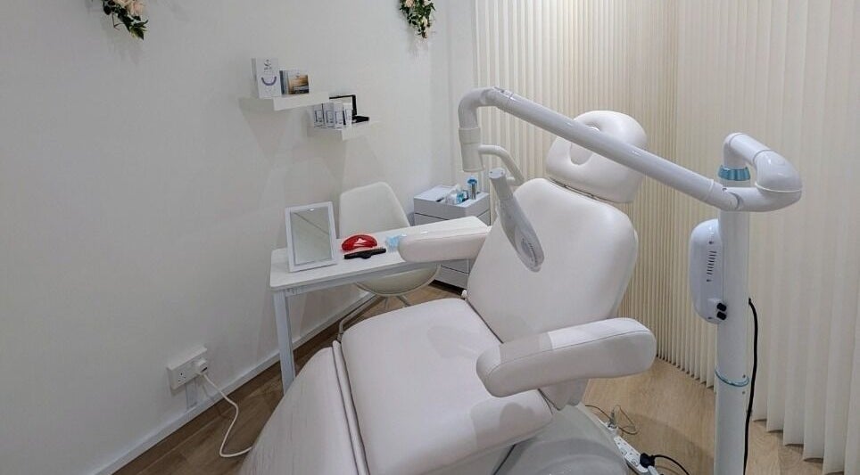 Bright treatment room at LAPIS WHITENING, featuring a white chair, Singapore, Singapore, SG.