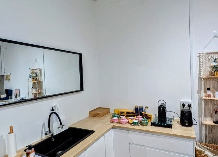 Modern beauty station at LAPIS WHITENING, Singapore, SG with mirror and elegant shelving decor.