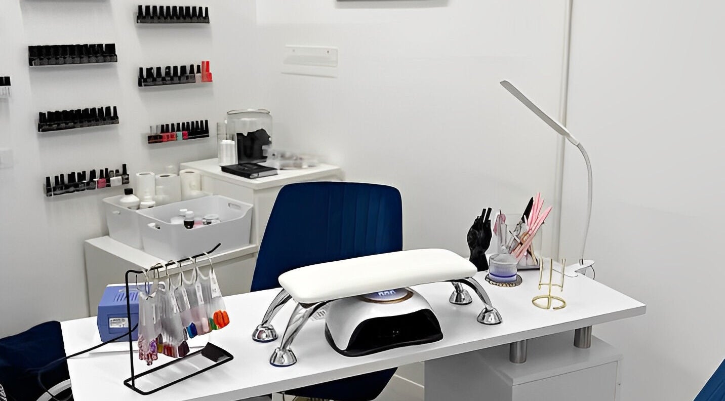 Modern nail station at Addictive Beauty Hugglescote, England, GB showcasing manicure tools and polish.
