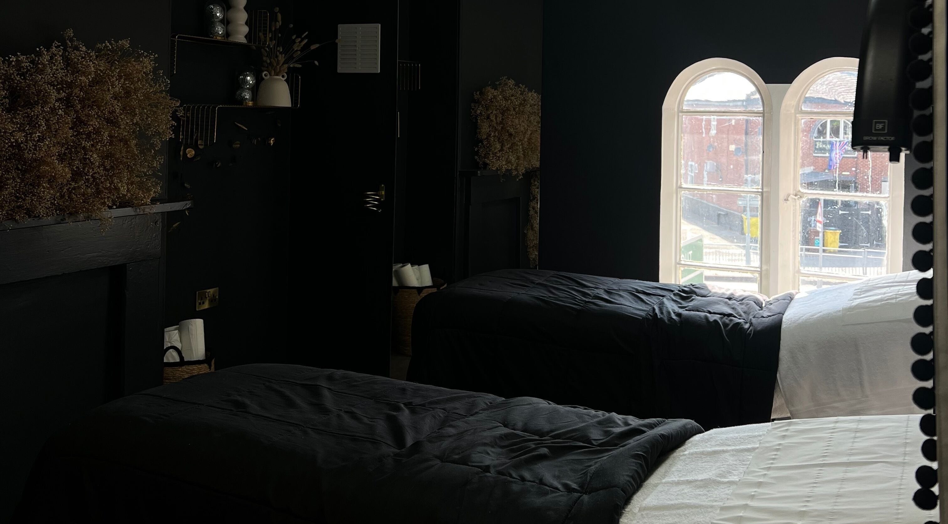 Cozy treatment room at beautybyella in Newcastle-under-lyme, England, GB with elegant decor and natural lighting.