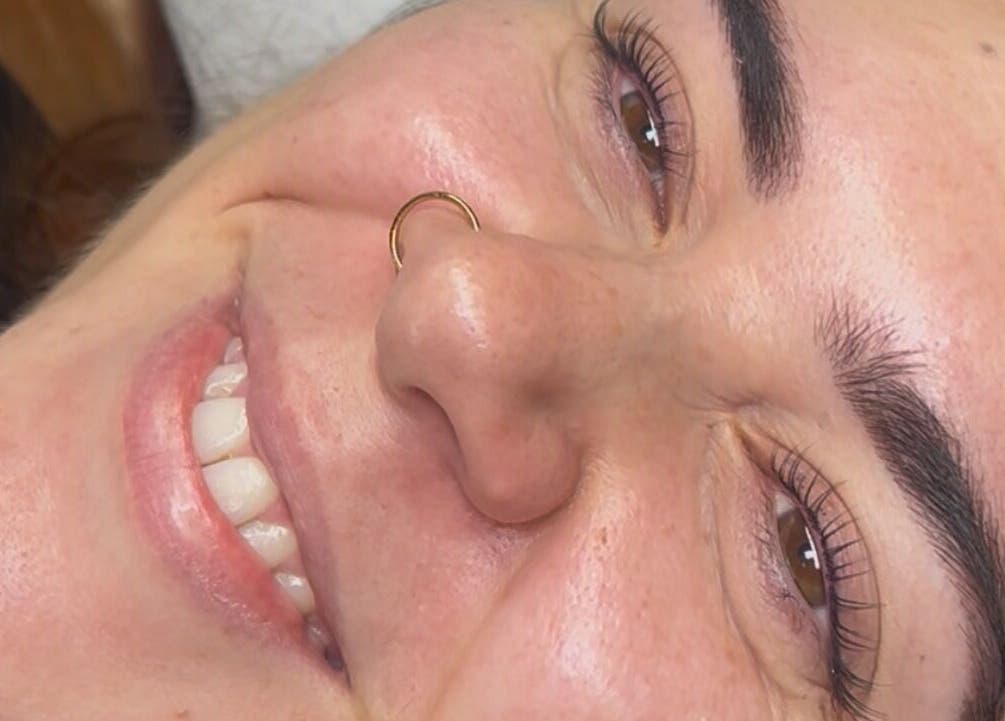 Smiling client after eyebrow treatment at beautybyella, Newcastle-under-lyme, England, GB.