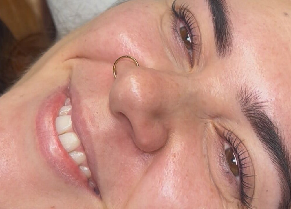 Smiling client after eyebrow treatment at beautybyella, Newcastle-under-lyme, England, GB.