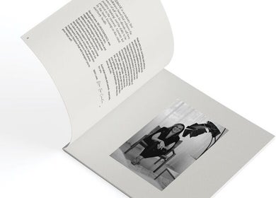 Open brochure with stylist at Astrid Salt Hair And Beauty Design, Budgewoi, New South Wales, AU.