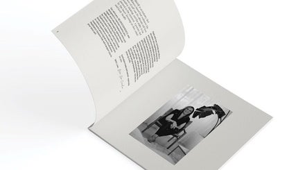 Open brochure with stylist at Astrid Salt Hair And Beauty Design, Budgewoi, New South Wales, AU.