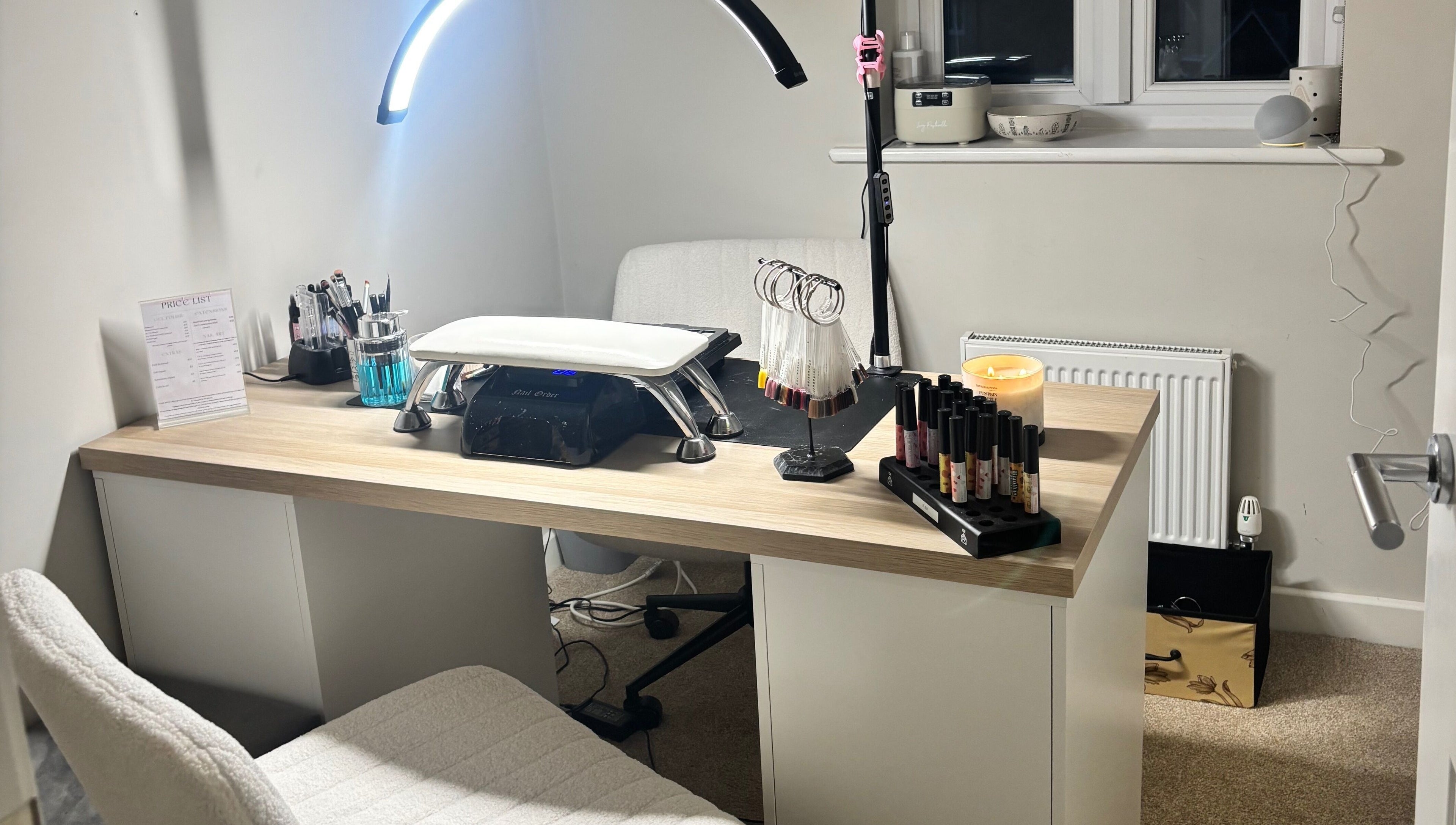 Modern nail station at nailsbyeloise, Great Blakenham, England, GB. Features polishes and tools for perfect care.