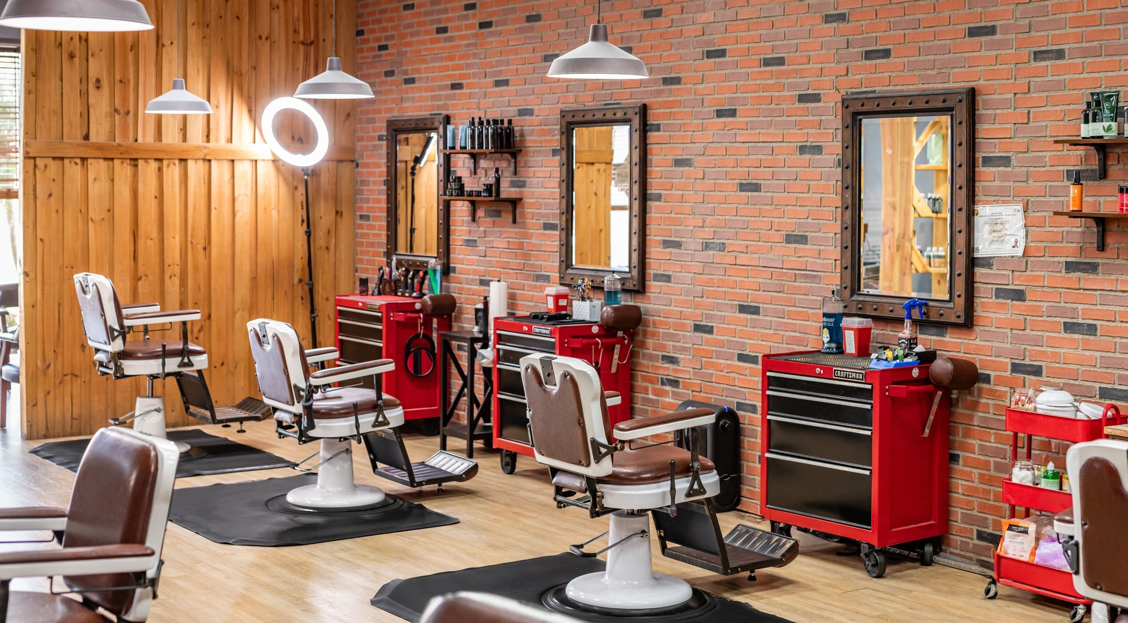 Interior of Turning Heads Barbershop in Winter Garden, Florida, US with vintage barber chairs and tool stations.