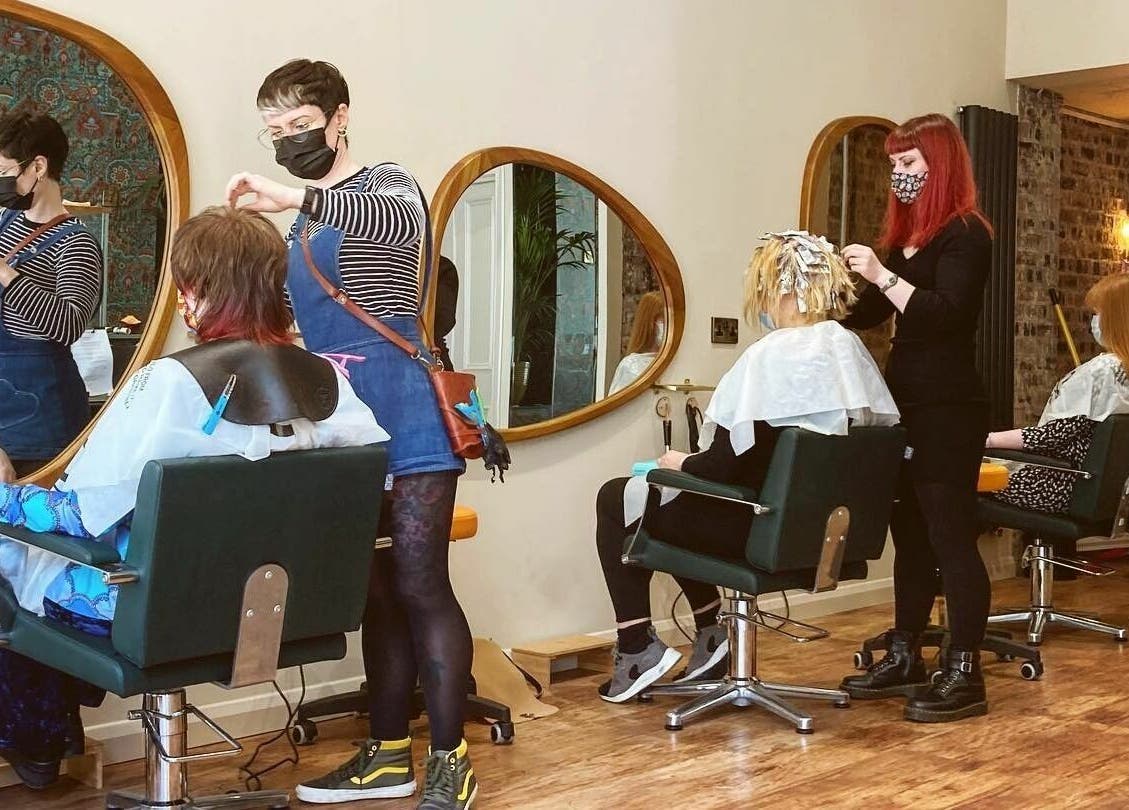 Stylists at work in Outline Hair, Edinburgh, Scotland GB, creating beautiful hair designs for clients.