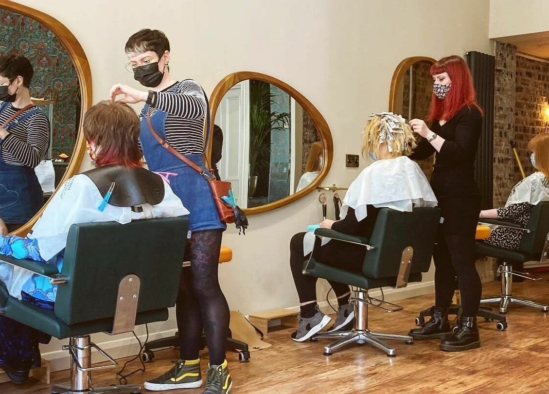 Stylists at work in Outline Hair, Edinburgh, Scotland GB, creating beautiful hair designs for clients.