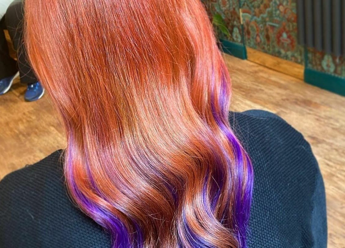 Bright red and purple hair styled at Outline Hair, located in Edinburgh, Scotland, GB.