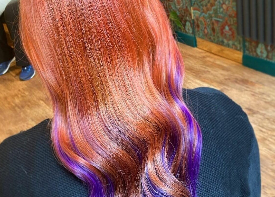 Bright red and purple hair styled at Outline Hair, located in Edinburgh, Scotland, GB.