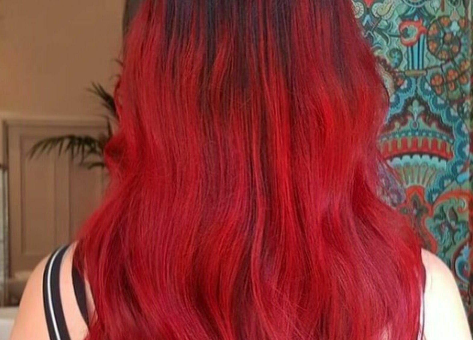 Vibrant red hair styled at Outline Hair, Edinburgh, Scotland, GB, showcasing expert coloring techniques.