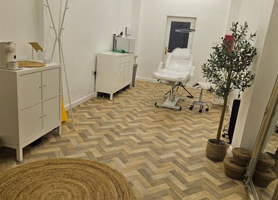 Elegant treatment room at Faces Aesthetics, Cwm-twrch Isaf, Wales, GB featuring modern decor and equipment.