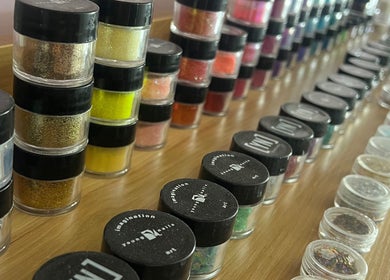 Colorful nail polish jars displayed at Hush Nail Scape in Cape Town, Western Cape, ZA.