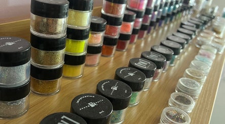 Colorful nail polish jars displayed at Hush Nail Scape in Cape Town, Western Cape, ZA.