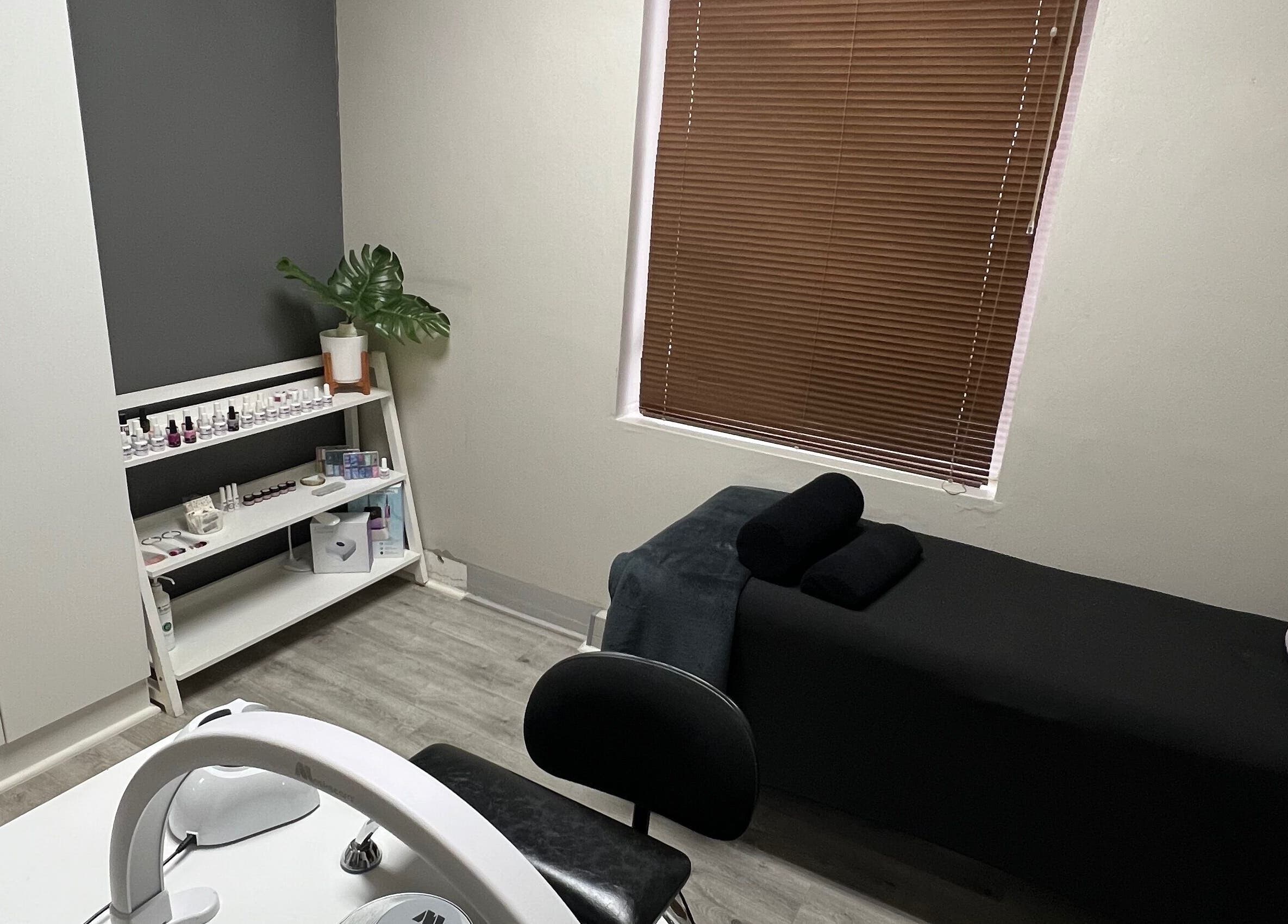 Relaxing spa room at Hush Nail Scape in Cape Town, Western Cape, ZA featuring a massage bed and nail care station.