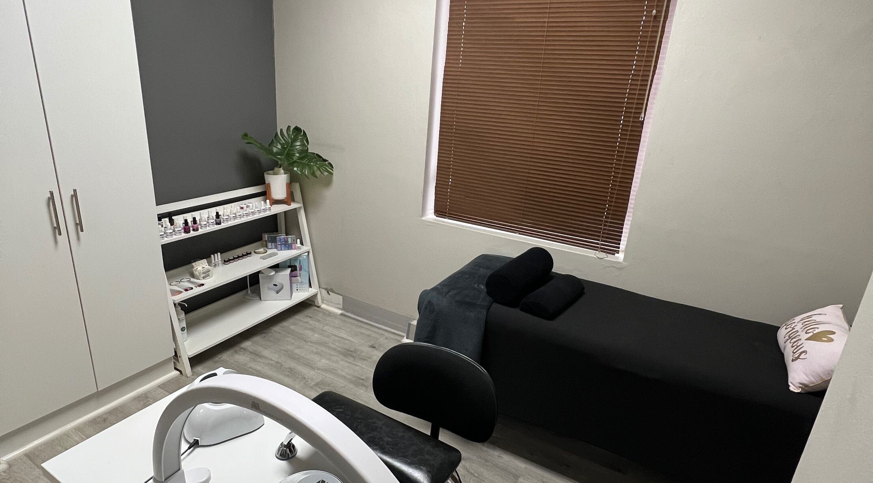 Relaxing spa room at Hush Nail Scape in Cape Town, Western Cape, ZA featuring a massage bed and nail care station.