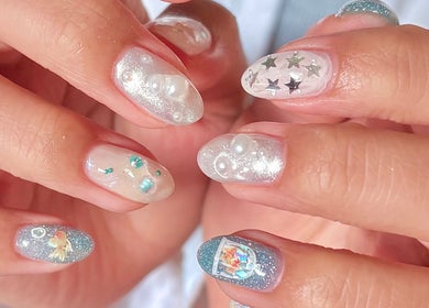 Elegant nail art with glitter and stars at ZozoStudio, Vancouver, British Columbia, CA.