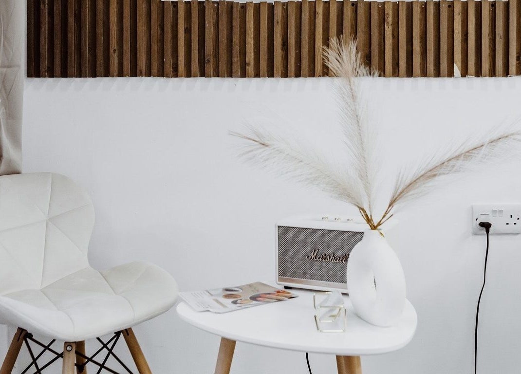 Stylish white seating area with decor at Just For You, Naxxar, MT.
