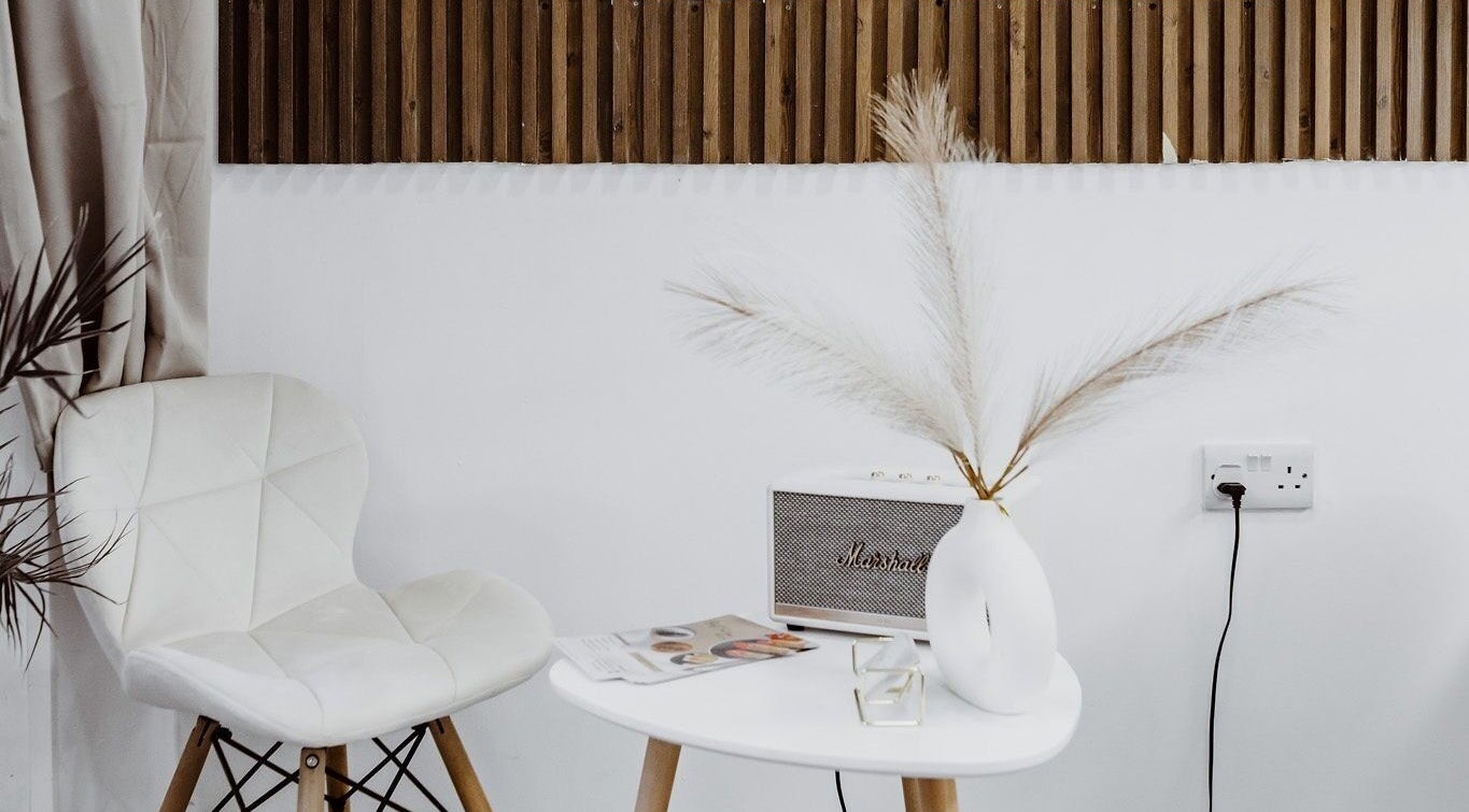 Stylish white seating area with decor at Just For You, Naxxar, MT.