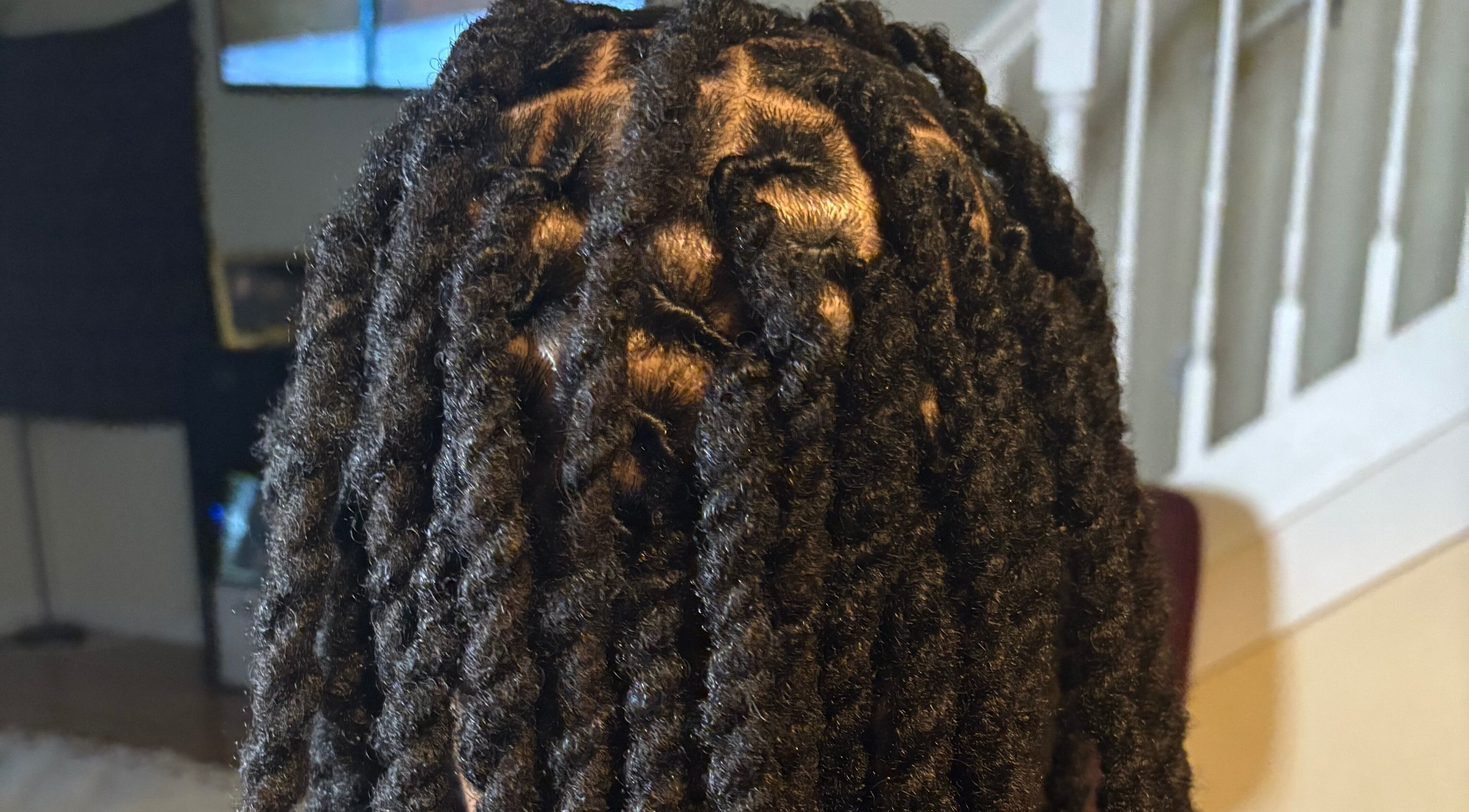 Beautiful dreadlocks styled at Locs by Ocqua, Gainesville, Florida, US, showcasing intricate hair design.
