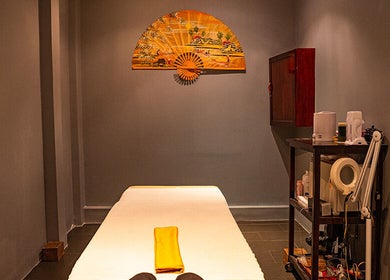 Massage room at Pure Vietnam Beauty and Spa in Thành phố Nha Trang, Khánh Hòa, VN with serene decor and table.
