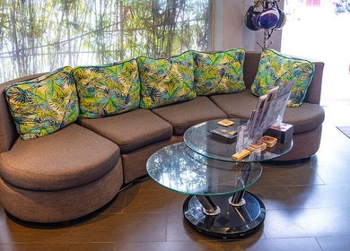 Cozy seating area with tropical pillows at Pure Vietnam Beauty and Spa, Thành phố Nha Trang, Khánh Hòa, VN.