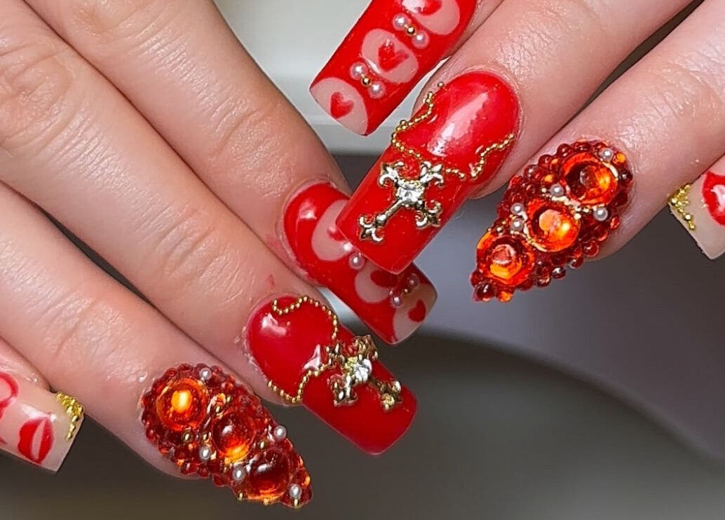 Exquisite red nail art with gems by Layla Jayne in Newcastle upon Tyne, England, GB.