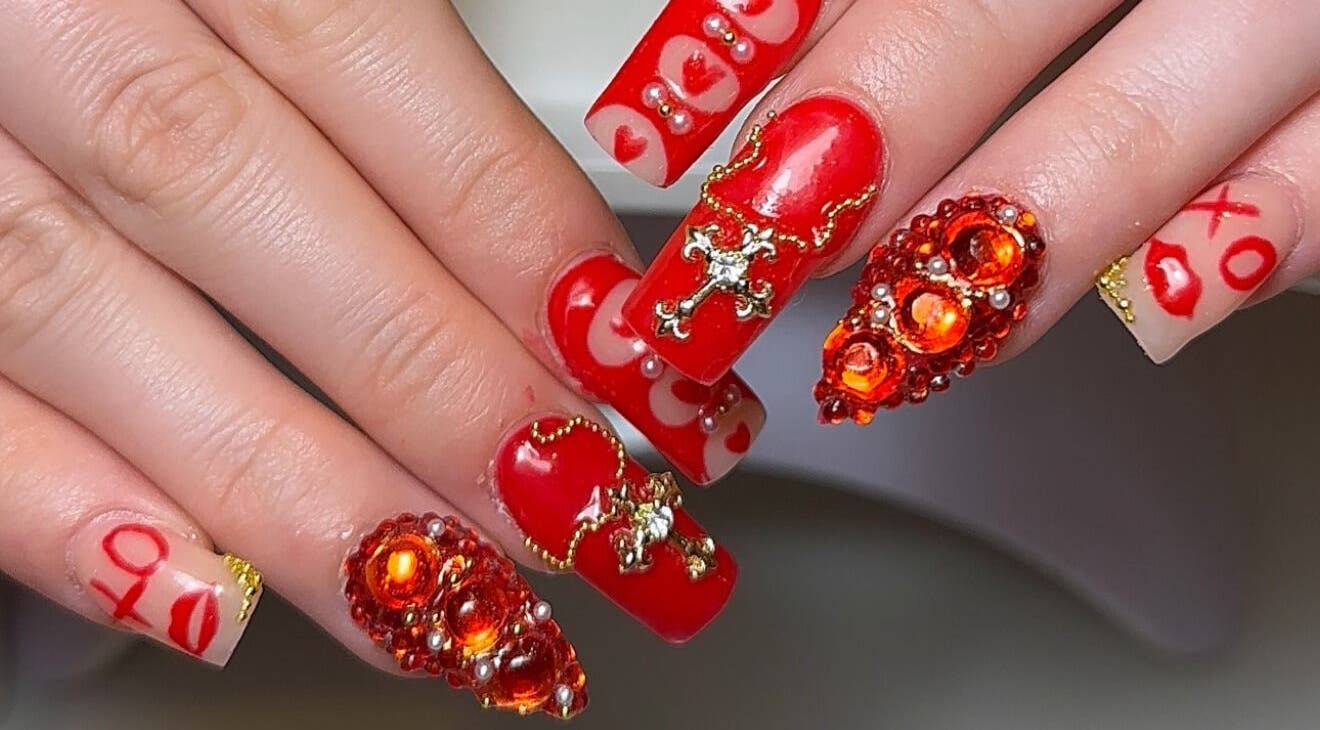 Exquisite red nail art with gems by Layla Jayne in Newcastle upon Tyne, England, GB.