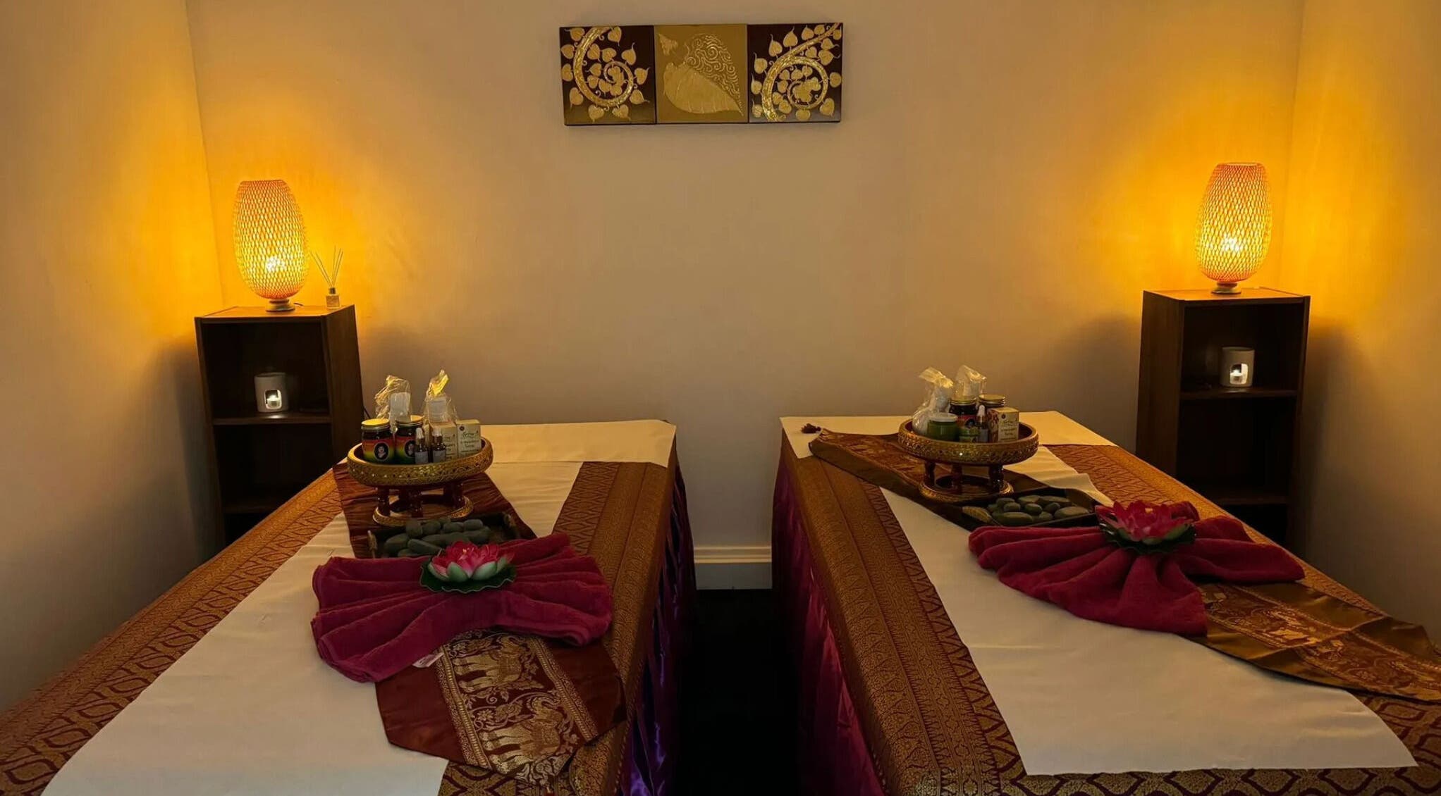 Relaxing massage room at Sawatdee Thai Therapy, Cardiff, Wales, GB, with warm lighting and elegant decor.