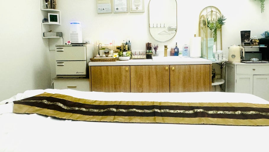 Relaxing massage room at Disara Thai Massage, Las Vegas, Nevada, US with elegant decor and soothing atmosphere.