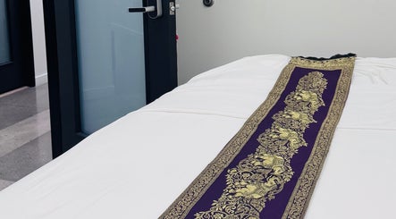 Massage table with ornate Thai fabric at Disara Thai Massage, Las Vegas, Nevada, US.