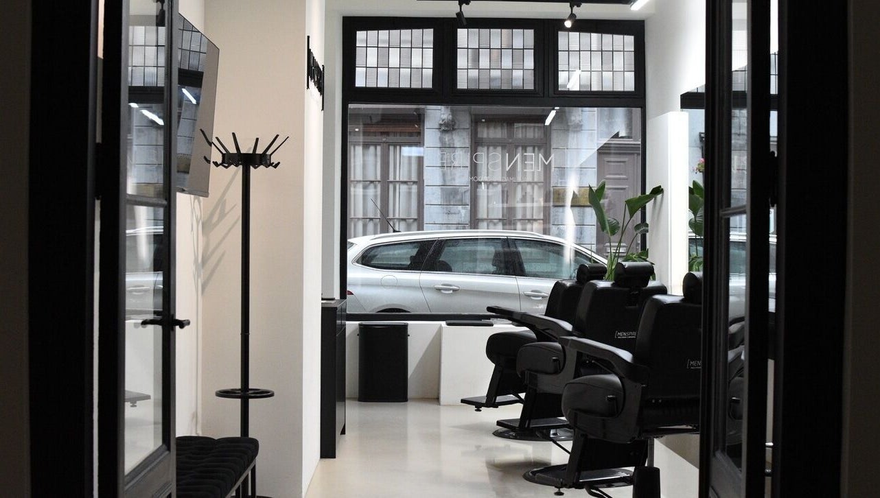 Interior of MENSPIRE Maastricht with sleek barber chairs at Maastricht, Limburg, NL.