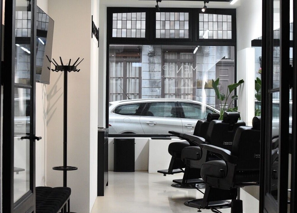 Interior of MENSPIRE Maastricht with sleek barber chairs at Maastricht, Limburg, NL.