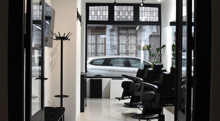Interior of MENSPIRE Maastricht with sleek barber chairs at Maastricht, Limburg, NL.