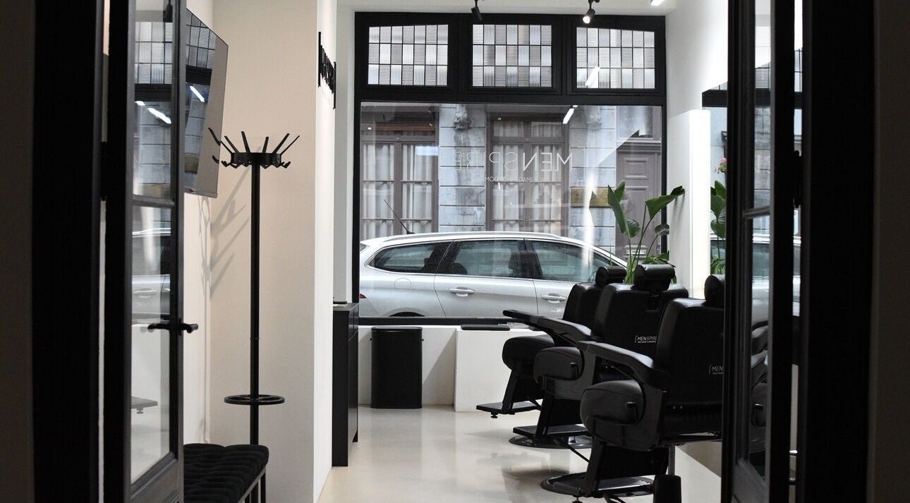 Interior of MENSPIRE Maastricht with sleek barber chairs at Maastricht, Limburg, NL.