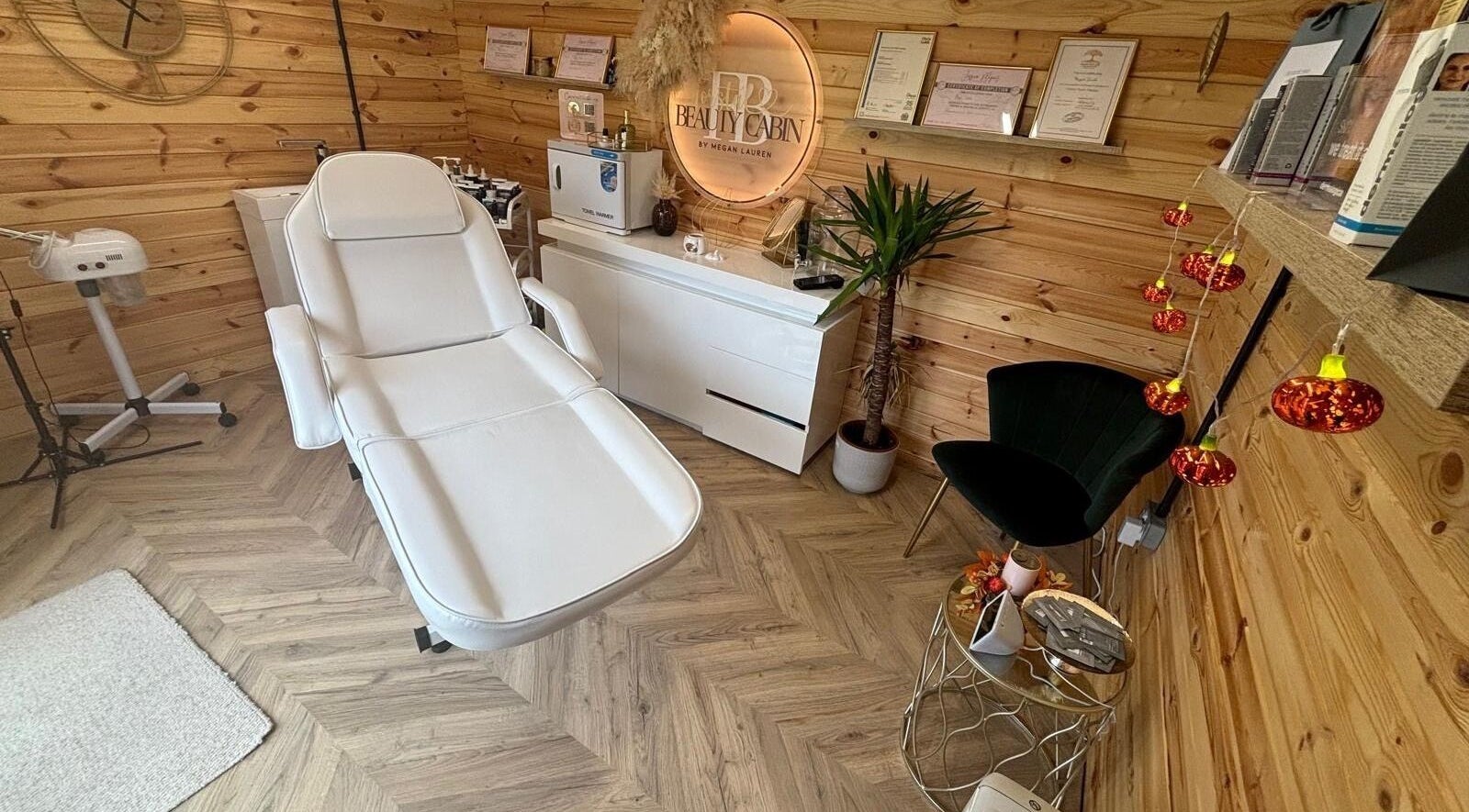 Relaxing interior of Forstal Beauty Cabin in Coxheath, England, GB with a comfortable treatment bed.