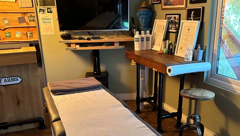 Cozy massage room at BTH Sports Massage, Heanor, England, GB, with a massage table and calming decor.