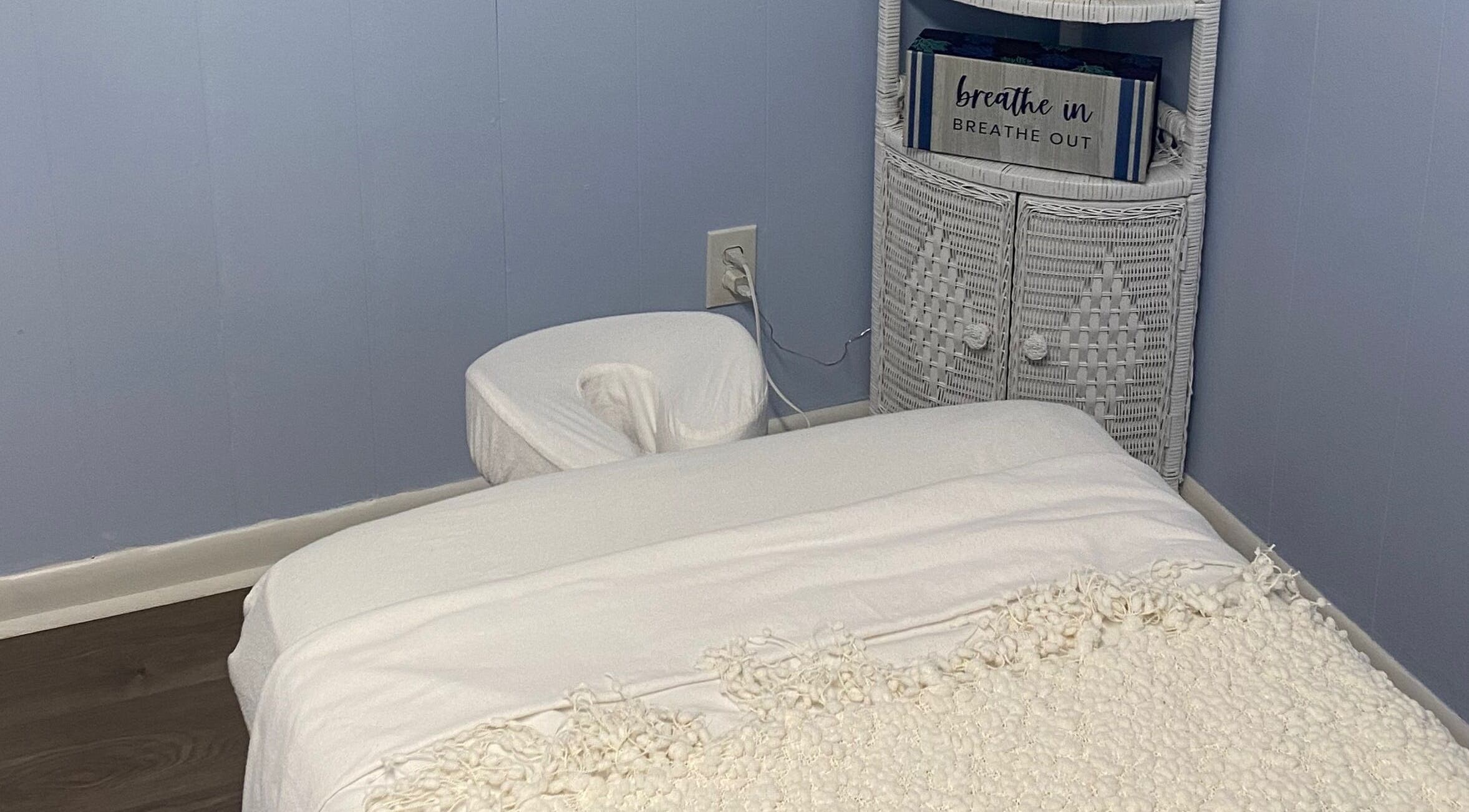 Cozy massage room at Massage by April, Scottsboro, Alabama, US with a plush table and calming decor.