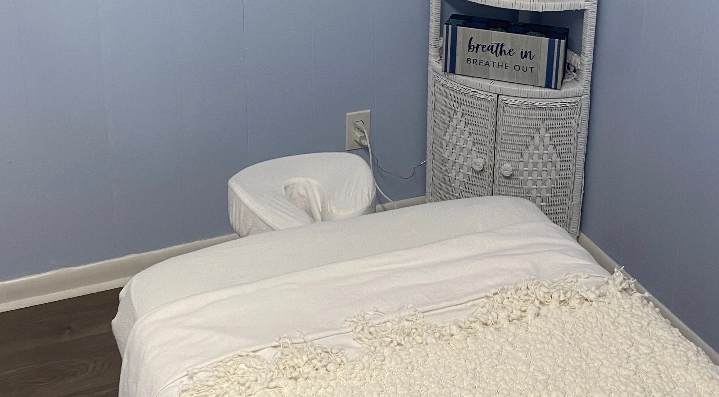 Cozy massage room at Massage by April, Scottsboro, Alabama, US with a plush table and calming decor.