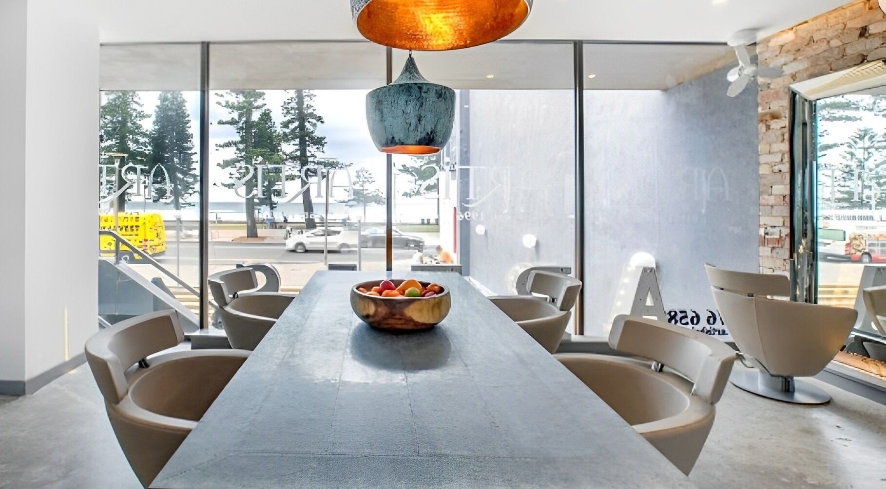 Modern interior at Studio 8 Hair - Manly, featuring ocean views from Manly, New South Wales, AU.