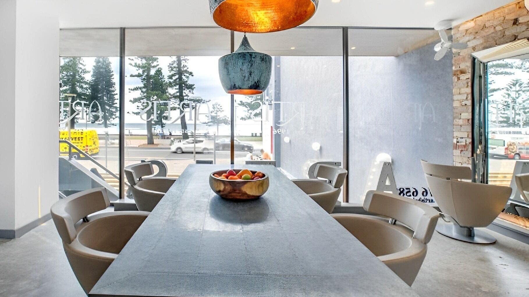 Modern interior at Studio 8 Hair - Manly, featuring ocean views from Manly, New South Wales, AU.