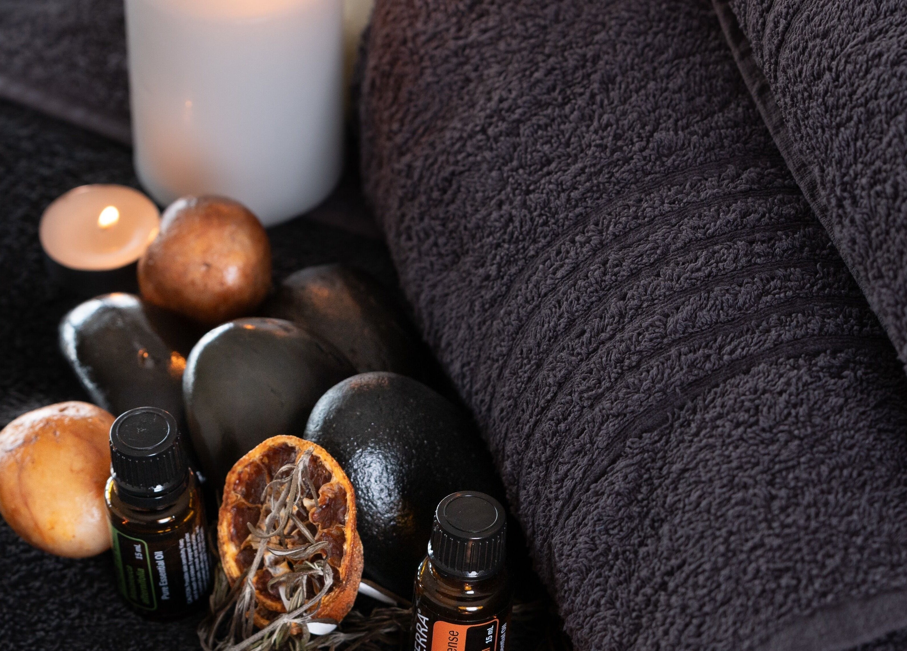 Essential oils with stones and candles at Shërimi Massage Hoedspruit, Hoedspruit, Limpopo, ZA.