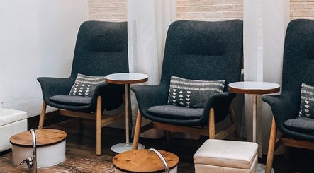 Comfortable lounge chairs in Polished Spa, offering a relaxing atmosphere in Sharjah, AE.