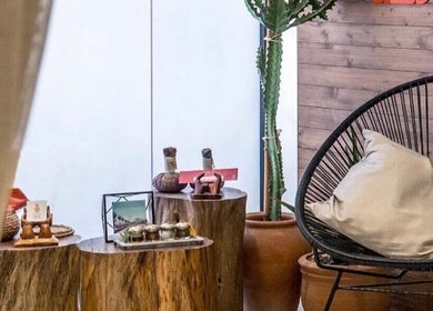Relaxing corner at Polished Spa, Sharjah, AE, featuring natural decor and a comfortable chair.