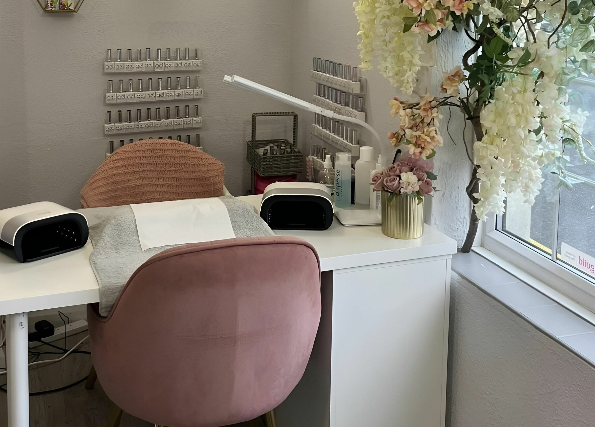Cozy nail station at Seaside Retreat in Peel, Peel, IM with elegant decor and a plush pink chair.