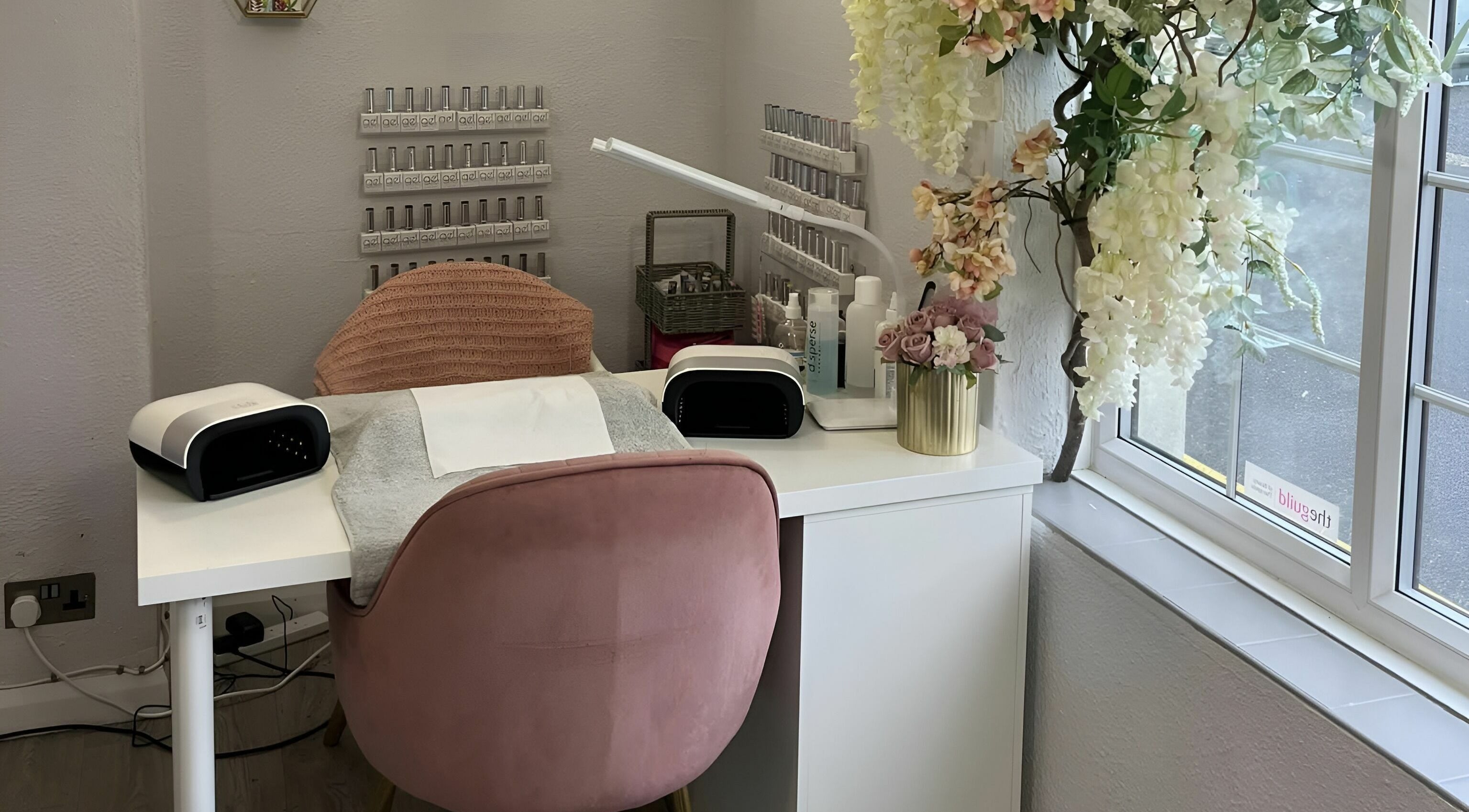 Cozy nail station at Seaside Retreat in Peel, Peel, IM with elegant decor and a plush pink chair.