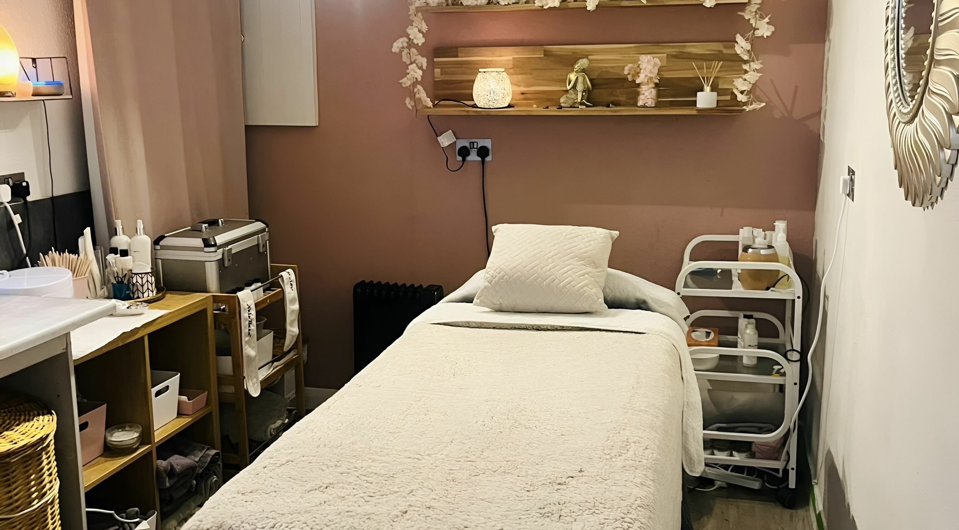 Calming massage room at Seaside Retreat, Peel, Peel, IM. Cozy setup with soft lighting and serene decor.